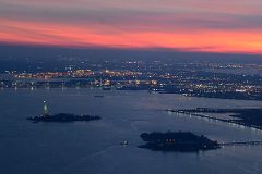 48 Statue Of Liberty And Ellis Island From One World Trade Center Observatory After Sunset.jpg